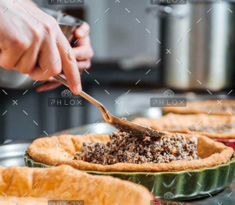 demo attachment 373 hands of cheif cook cooking and putting filling pesknnf